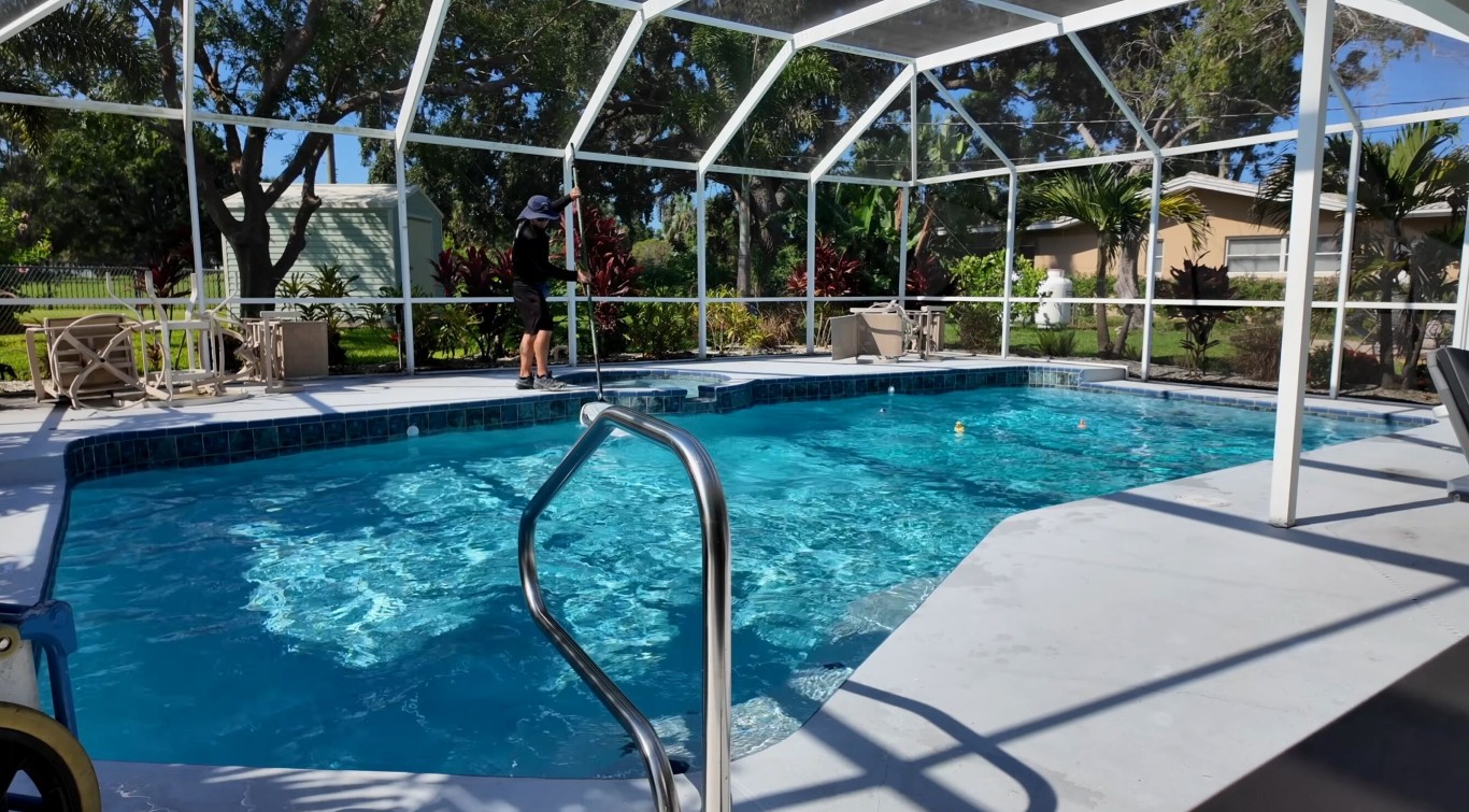 Weekly pool cleaning service maintaining crystal clear pool water
